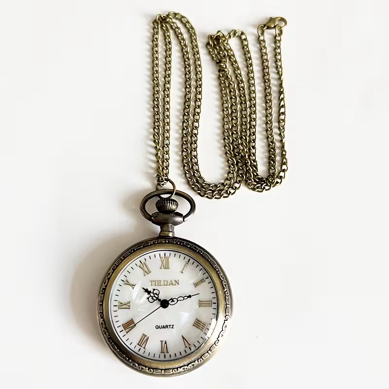 Reloj de bolsillo de esfera visible con su cadena en tono bronce