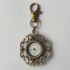 Reloj llavero con marco floral abierto en tono bronce y esfera blanca