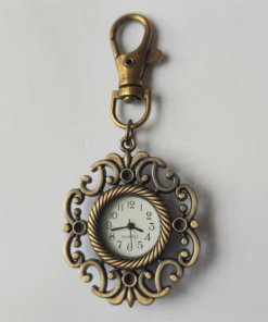 Reloj llavero con marco floral abierto en tono bronce y esfera blanca